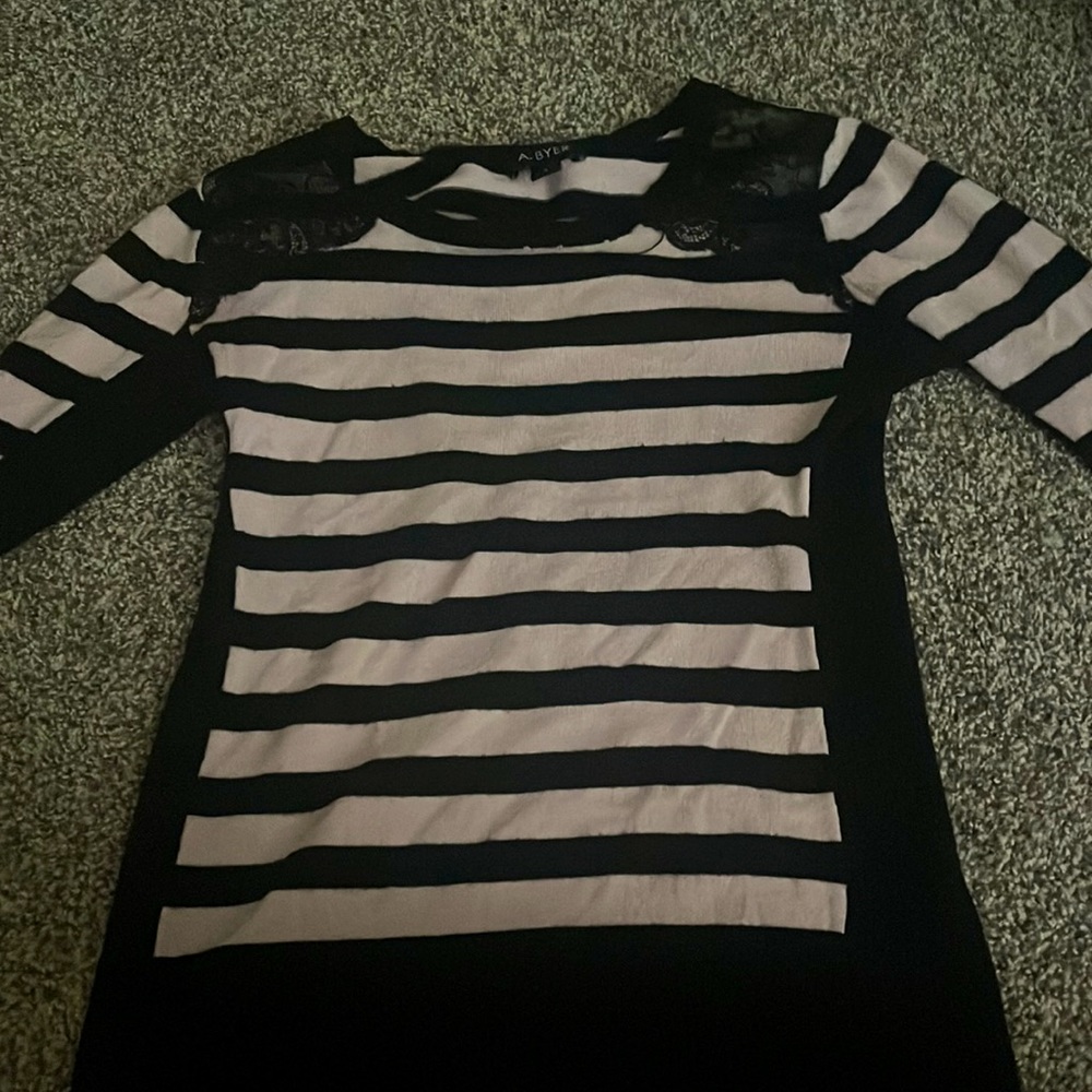 A striped pink and black long sleeve with lace sholders